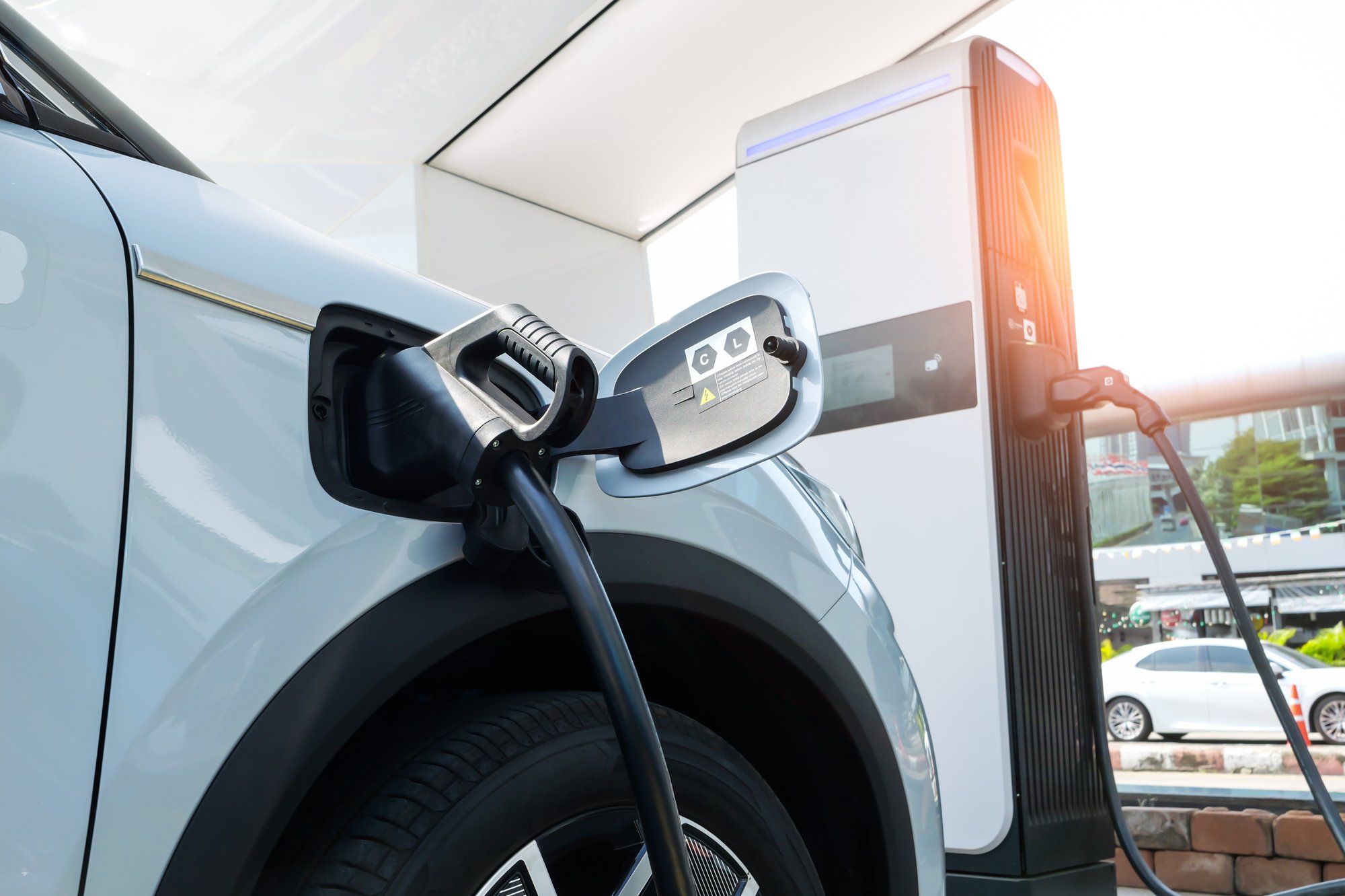 EV car plugged in charging EV car plugged in charging